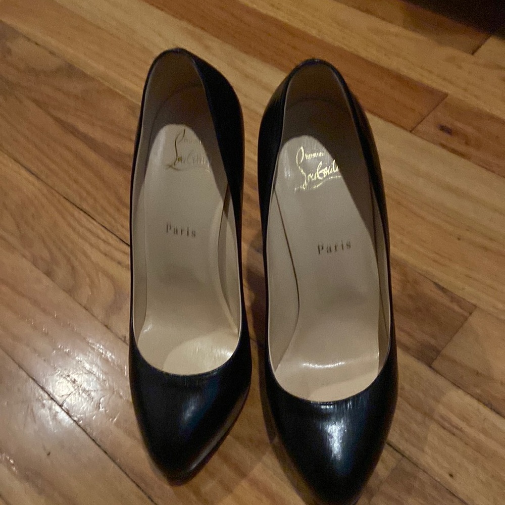 Black leather closed toe 5 inch heels with a 1 inch platform, worn a few times